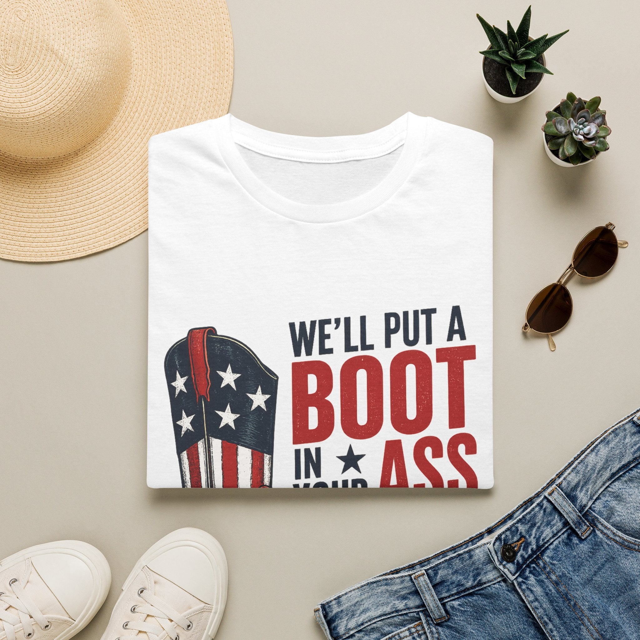 Patriotic Cowboy Boot T-Shirt — “We’ll Put a Boot in Your Ass, It’s the American Way”
