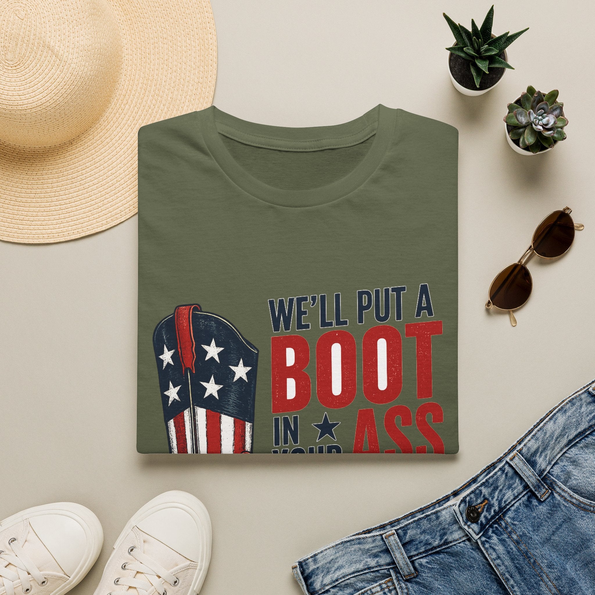 Patriotic Cowboy Boot T-Shirt — “We’ll Put a Boot in Your Ass, It’s the American Way”